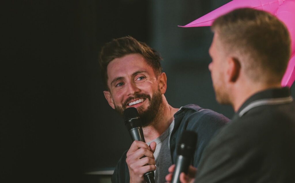 Alex Griffiths, Celtra's Sr. director of customer success on stage of Creative Connect, Celtra's exclusive event series, talking to a client.