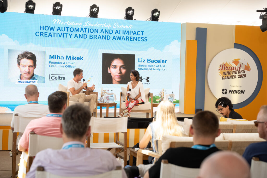 Celtra CEO Miha Mikek and Under Armour Global Head of AI Liz Bacelar posing at the Brand Innovators Cannes 2026 step and repeat banner.